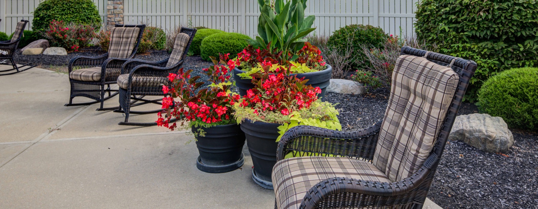 Outdoor courtyard with chairs and garden